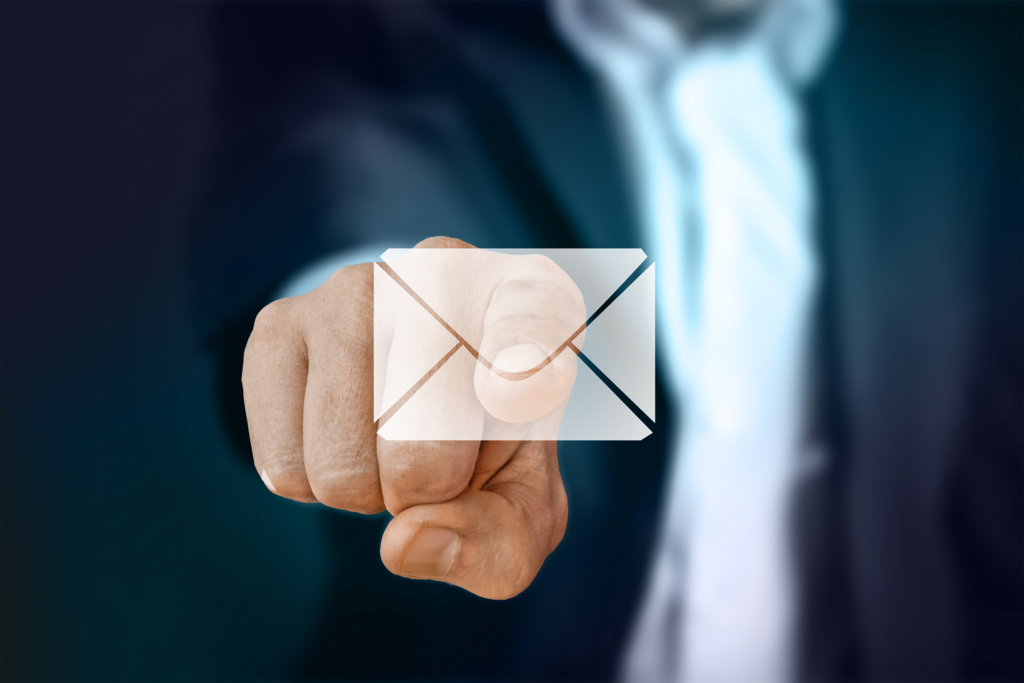 Finger pointing at an email symbol