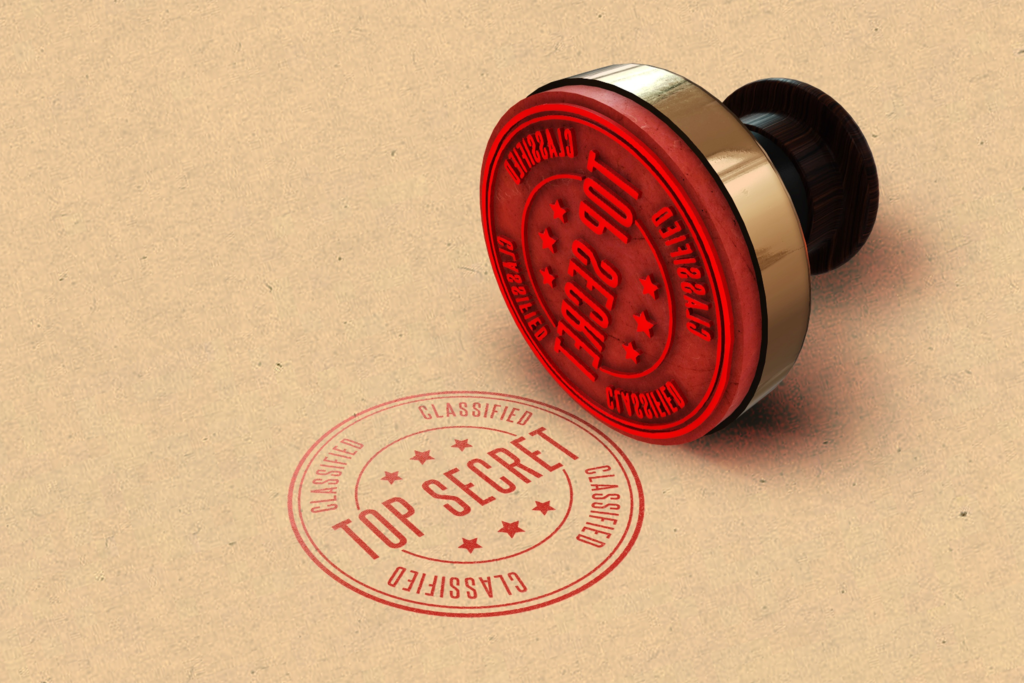 Rubber stamp and a red top secret seal